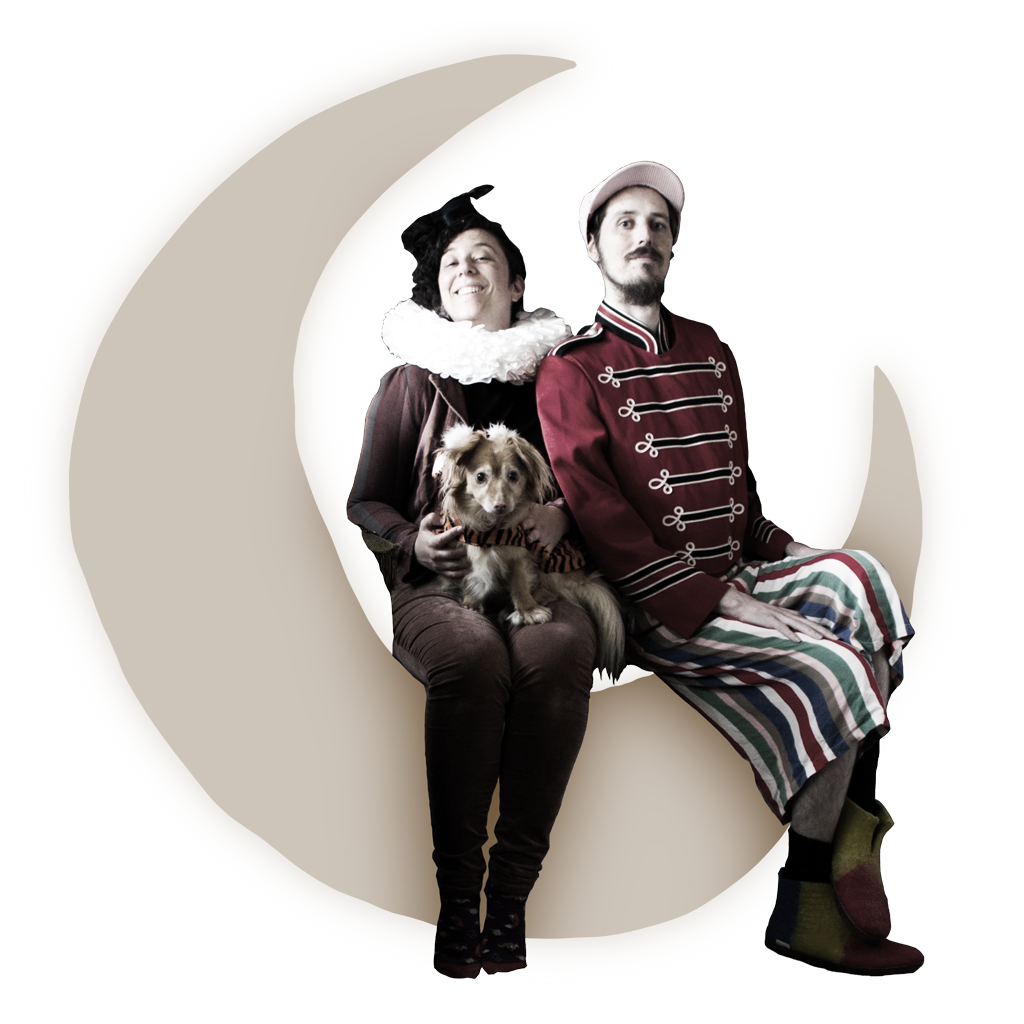 two critters sitting on the moon